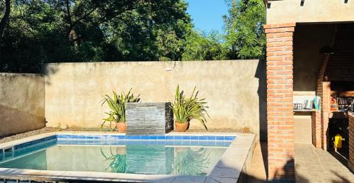 Capiata House | Habitación y piscina en casa compartida