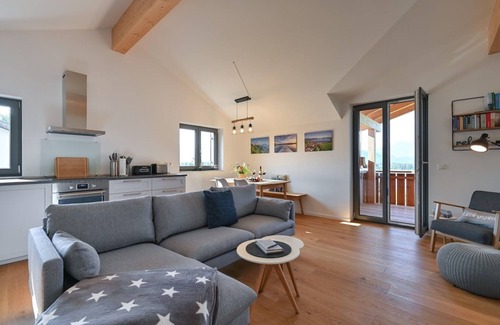 Hopfen am See Apartment | Happy Place - Modern penthouse with the best view of Lake Hopfensee & the mountains
