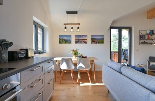 Hopfen am See Apartment | Happy Place - Modern penthouse with the best view of Lake Hopfensee & the mountains