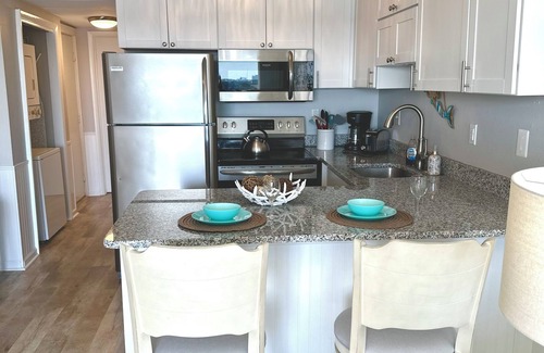 Heron Harbour Isle Condo | Harbour Sails Paradise: Panoramic Waterfront Views, Stunning Sunsets & Sunrises