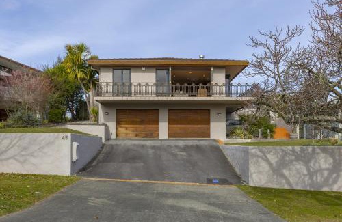 Waipahihi House | Harvey Lake House - stylish comfort with outdoor deck and lake views