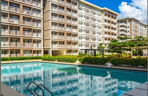 San Bartolome Condo | Heart of the city with the best staycation spot in town with pool access!