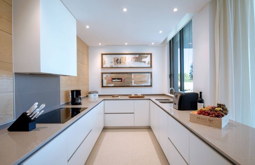 Vila Nova De Cacela Apartment | Heated pool, lush gardens, and air conditioning at Monte Rei.