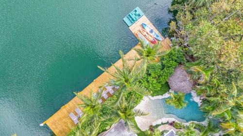 Poinsettia Heights House | Heated pool Lush Tropical Surrounding Castaway Key RESlDENCES