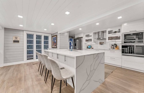 Merritt Island House | Heated Pool, Sleeps 21, 2 Kitchens, Custom Firepit, Outdoor Oasis, Near Beach