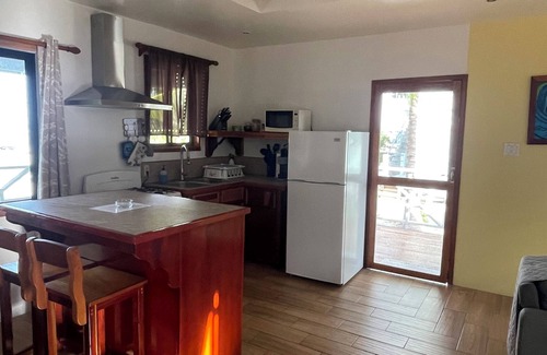 Caye Caulker Cottage | Hidden Treasure Vacation Home Bayblue Cottage Breathtaking view beautiful sunset