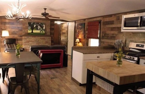 Cat Spring Cabin | Hideaway Cabin secluded & nestled in the live oaks with private outdoor Hot Tub!