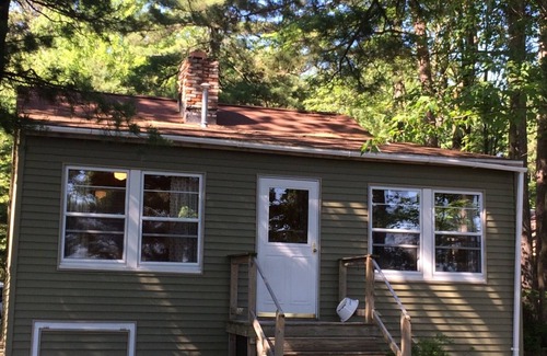 Higgins Lake Cottage | HIGGINS LAKE LAKEFRONT 4BED/2BA ON EXPANSIVE SANDY BEACH INCLUDES BOAT MOORING