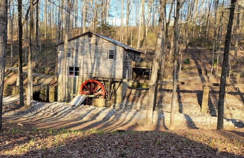 Cullman Cabin | Historic Cabin in a natural setting with waterfalls and covered bridge