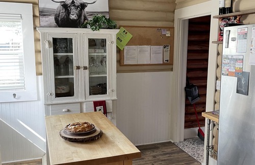 Buffalo House | Historic Log Cabin home on Main Street