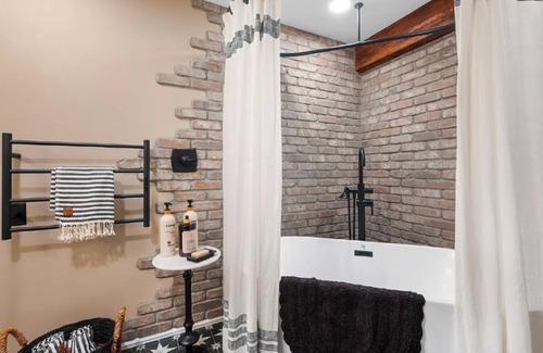 Snohomish House | Historic Speak Easy Wine Cellar and Movie Theatre Guest Room