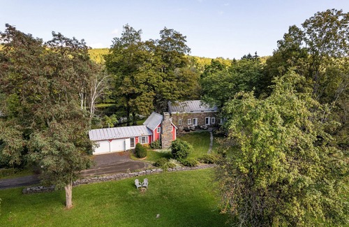 Accord House | Historic stone house & barn on 10 acres with patio, fireplace, & antique charm