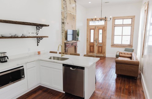 Faubourg Delassize House | historic uptown shotgun off st Charles ave