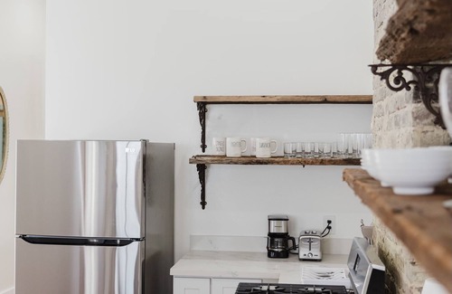 Faubourg Delassize House | historic uptown shotgun off st Charles ave