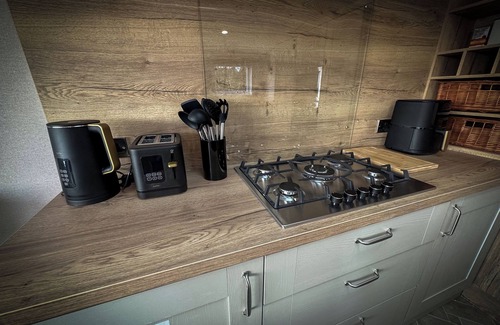 Longridge Cabin | Hobbit - House Of The Owl.nLuxury lodge with views. Pet friendly. Indoor Pool.