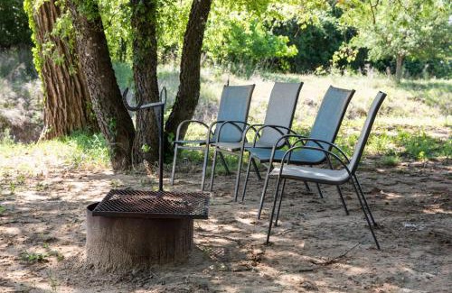 Dennis Ski Chalet | Hobbit Treehouse with waterfall on the Brazos River! 350 acres! Tubing! Petting zoo!