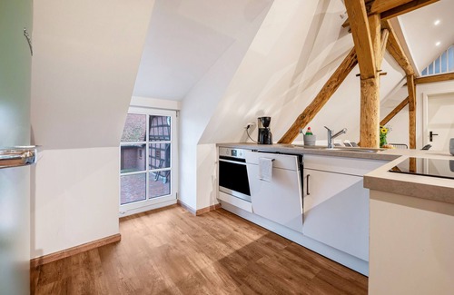 Strohen Apartment | Holiday apartment "Eichengeflüster Schwalbenloft" with a private terrace under the oaks