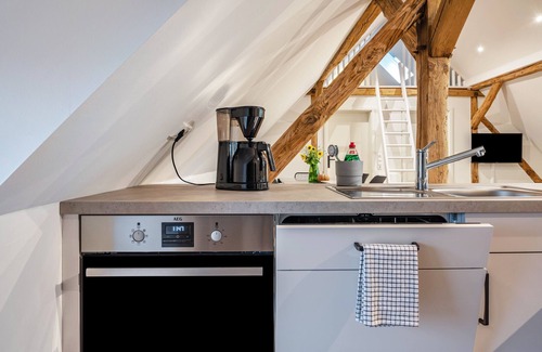 Strohen Apartment | Holiday apartment "Eichengeflüster Schwalbenloft" with a private terrace under the oaks