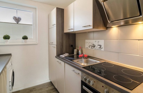 Wangerland Apartment | Holiday Apartment 'Nordsee' with Shared Terrace, Shared Garden & Wi-Fi