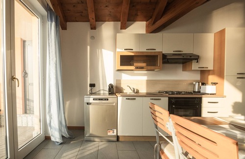 Reno House | Holiday Home 'Attico Borromea' with Lake View, Shared Pool and Wi-Fi