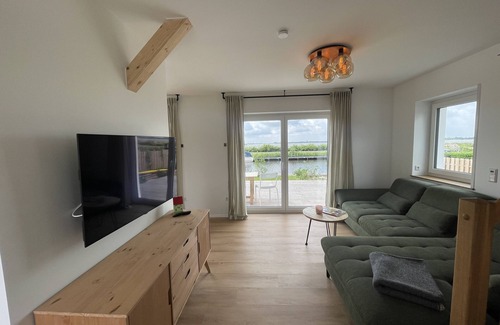 Bedekaspel House | Holiday Home 'Haus Am Meer 8' with Lake View, Private Terrace and Private Garden