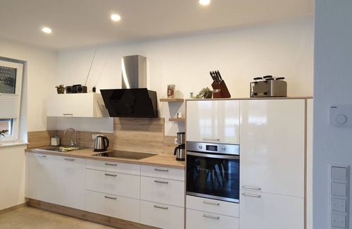 Walchum House | Holiday Home "Haus Seestern" with Lake View, Private Terrace and Wi-Fi