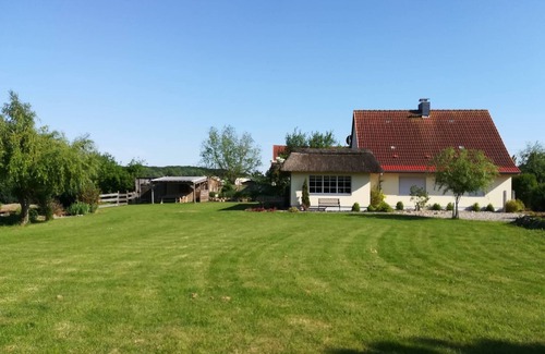 Kalkhorst House | Holiday Home "Naturteich Haus" with Private Swimming Pond, Private Terraces & Wi-Fi