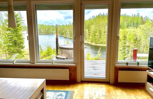 Tived House | Holiday home Tived - directly on lake, sauna, boat, hot tub