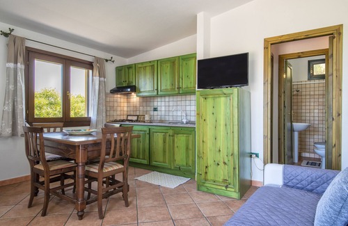 Paduledda House | Holiday Home "Vista Mozzafiato ad Isola Rossa" with Sea View, Private Terrace & A/C