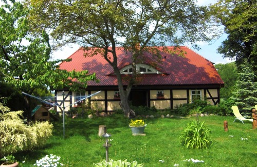 Garz/Rugen House | Holiday home with fireplace, patio and a view of nature