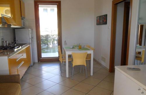 Bibione Lido del Sole Apartment | Holiday village escape with garden and fireplace