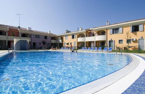 Bibione Lido del Sole Apartment | Holiday village escape with garden and fireplace