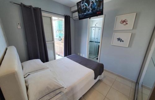 Centro House | Home 1 | Ap Cinema Frente Mar com Piscina Aquecida em Bertioga