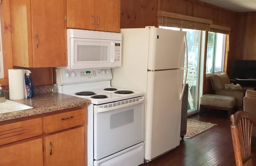 Mears Cottage | Home on the lake. Walk out your door for Swimming, boating or morning coffee.