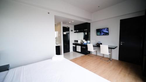 Wonokromo Apartment | Homey Studio No Kitchen at Grand Darmo Suite Apartment By Travelio