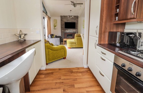 Kinmel Bay Cottage | HONEYSUCKLE LODGE, pet friendly, character holiday cottage in Towyn