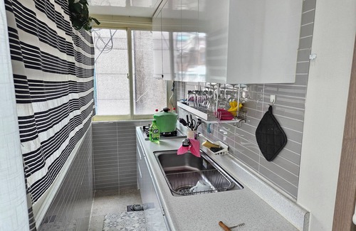Seogyo-dong Bed & Breakfast | Hongdae: Spacious yard, group-friendly. Green, sunny, near biz—cozy