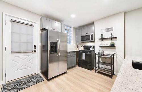 Lower Lawrenceville House | ★ HostWise Stays ★ Stunning Remodel, Off-Street Parking, Amazing Location!