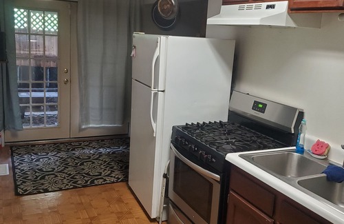Sand Lake Apartment | Hot Tub and King bed with 3 other beds