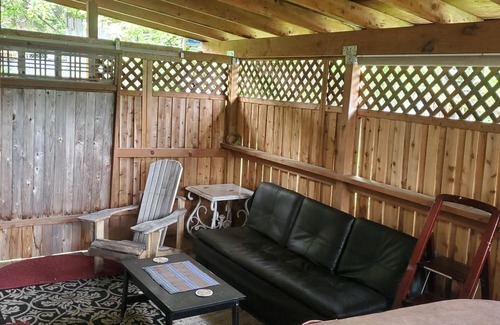 Sand Lake Apartment | Hot Tub and King bed with 3 other beds