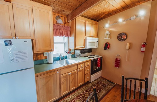 Heltonville Cabin | Hot tub overlooking Lake Monroe. Pet Friendly!
