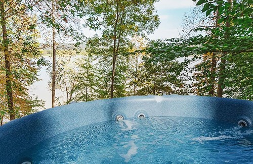 Heltonville Cabin | Hot tub overlooking Lake Monroe. Pet Friendly!