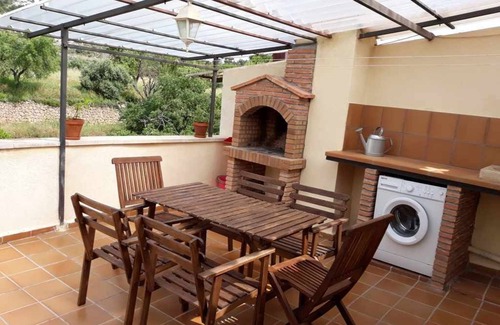 Beceite Apartment | House Ana III. Attic terrace and fireplace