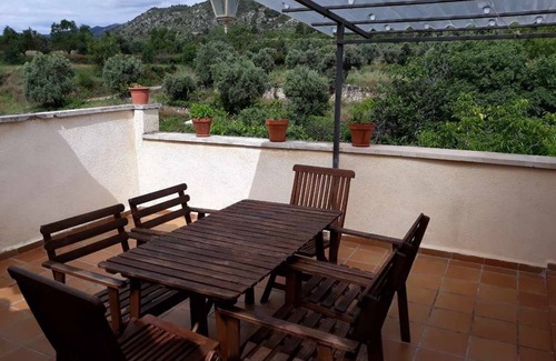 Beceite Apartment | House Ana III. Attic terrace and fireplace