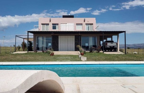 Nueva Cordoba House | House by the lake Puerto del Aguila inbalo 01