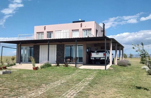 Nueva Cordoba House | House by the lake Puerto del Aguila inbalo 01
