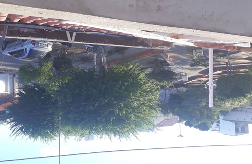 Itaberaba House | HOUSE IN FRONT OF A GARDEN CALLED: SQUARE OF THE ANTS WITH 1ST FLOOR.