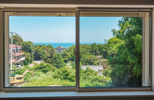 Kawazu House | House surrounded by trees with a dog run/Kamogun Shizuoka