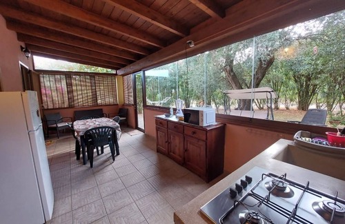 Iglesias Historic Centre Apartment | House The Ancient Olive Tree, nestled in a centuries-old olive grove with a large garden around it.