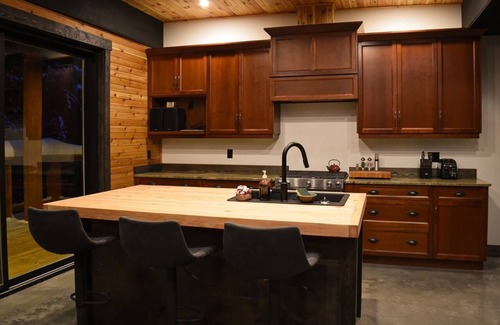 Rossland House | House with bridge, walk around deck, rooftop patio, 24' glass door & much more!